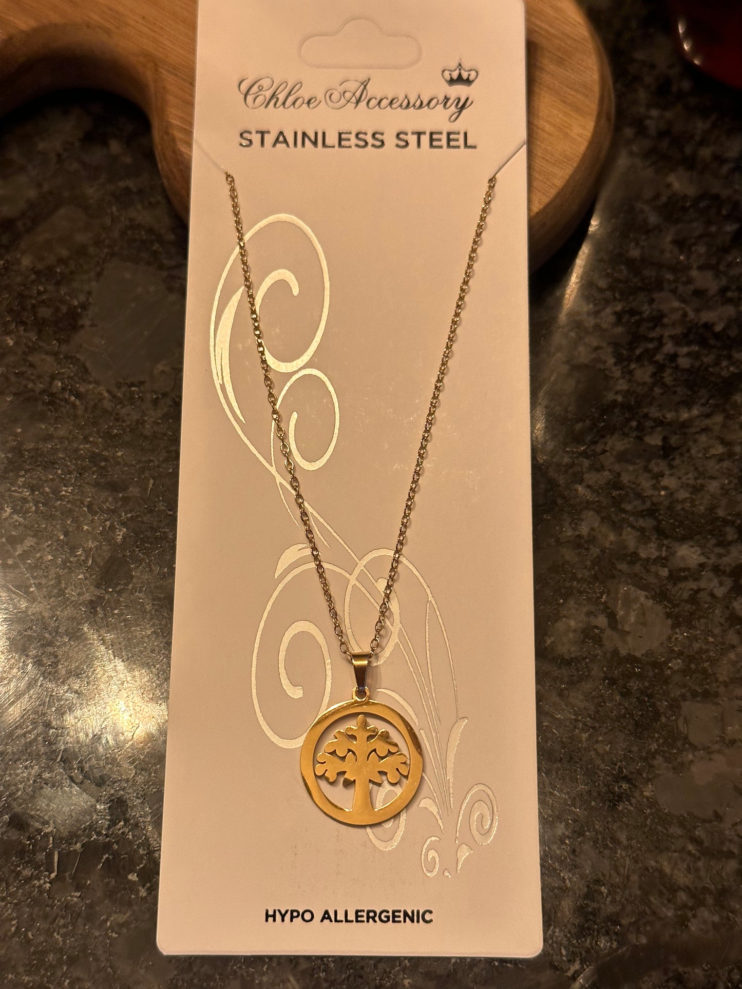 Stainless steel, hypo allergenic tree of life necklace.